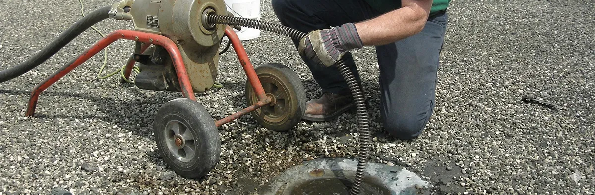 sewer rodding technician actively removing blockages from a sewer line in Colorado Springs, CO